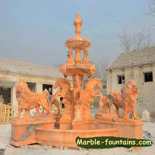 red-marble-fountain-with-lion-statues